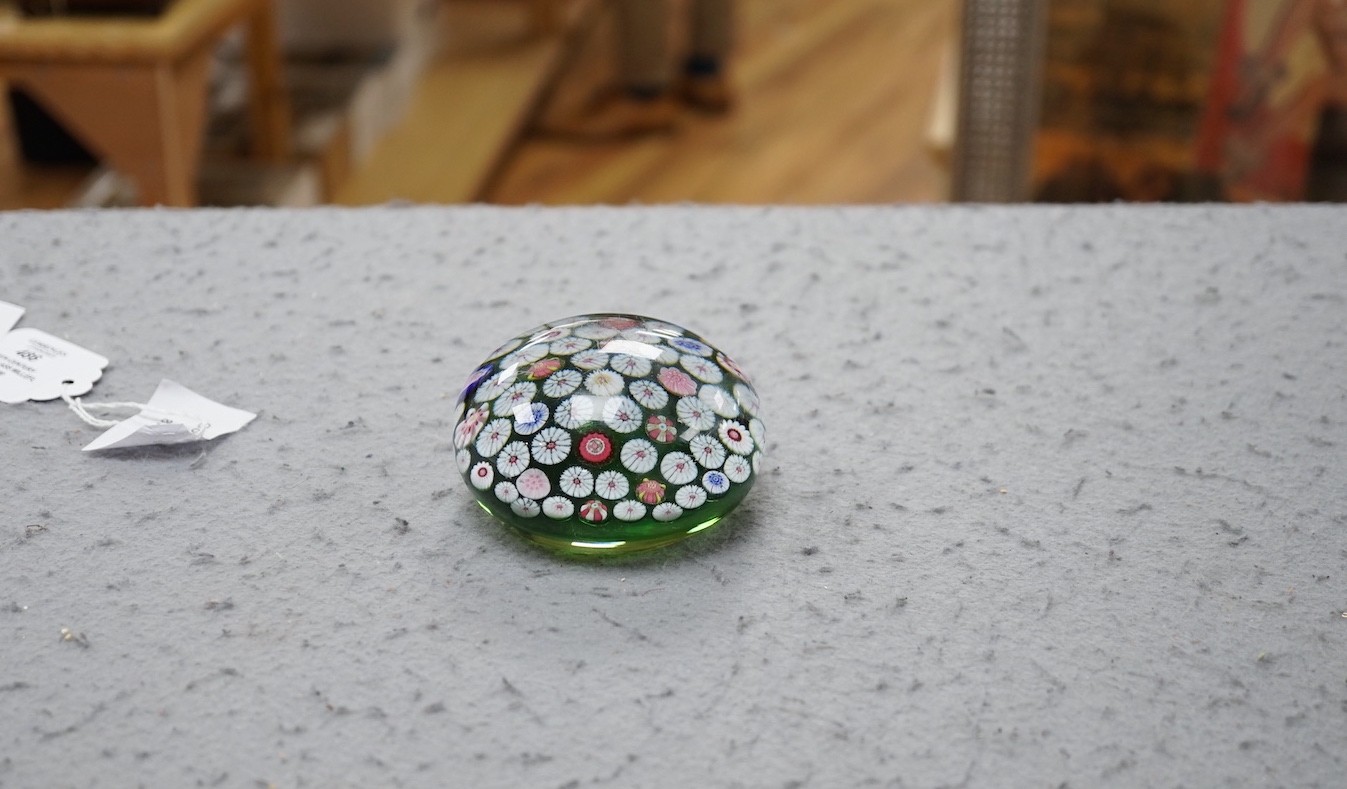 A 19th century French glass millefleur spaced cane paperweight, 8.5cms diameter